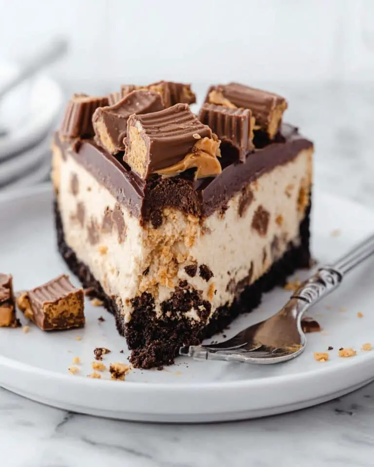 Festive Reese’s Cheesecake with Brownie Crust and Peanut Butter Cup Topping Recipe