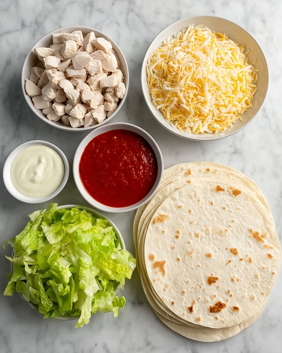 A white marbled background holds five white bowls and a stack of soft flour tortillas. The top right bowl is filled with small, light beige pieces of cooked chicken. Below, a stack of four pale, round tortillas with light brown spots from cooking sits slightly overlapping. To the left of the tortillas, a bowl brimming with shredded yellow cheddar cheese shows thin strands with a slightly rough texture. Above this, a pile of freshly chopped green lettuce with various light and dark green shades lies loose on the surface. At the top left corner, a white bowl contains a smooth, dark red sauce, and next to it, a smaller white bowl is filled with a creamy white sauce. Photo taken with an iphone --ar 4:5 --v 7