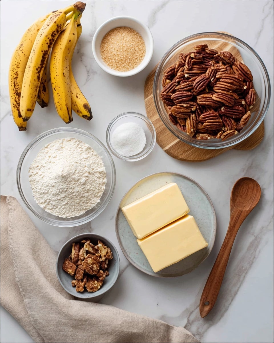 The image shows various baking ingredients arranged on a white marbled surface. There are two yellow bananas with brown spots at the top left, next to scattered small nuts or seeds. A small white bowl with brown sugar is placed near the bananas. A large clear glass bowl with dark brown pecans coated in spice sits on a small wooden board in the top right. Below this bowl, there is a smaller clear bowl filled with white granulated sugar. Two sticks of pale yellow butter rest on a white plate near the bottom left. In the center, a white bowl contains white flour. To the lower-left corner, a small bowl holds pieces of brown sugar chunks. A beige cloth napkin spreads across the lower right side, and on top lies a dark wooden spoon. The photo is taken with an iphone --ar 4:5 --v 7
