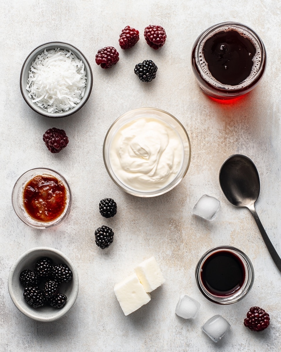 A tall clear glass filled with dark brown liquid and crushed ice, with creamy white swirls mixing through the drink, topped with a layer of light tan crushed nuts or flakes. A bright green lime wedge is placed on the rim of the glass. The glass is set on a white marbled surface with small pieces of the same crushed nuts scattered nearby. In the background, there are two fresh green limes—one whole and one cut in half—and a blurred white bottle with colorful writing and design. Small clear bowls with light tan syrup and crushed nuts also sit on the surface. The whole scene is bright and fresh. photo taken with an iphone --ar 4:5 --v 7