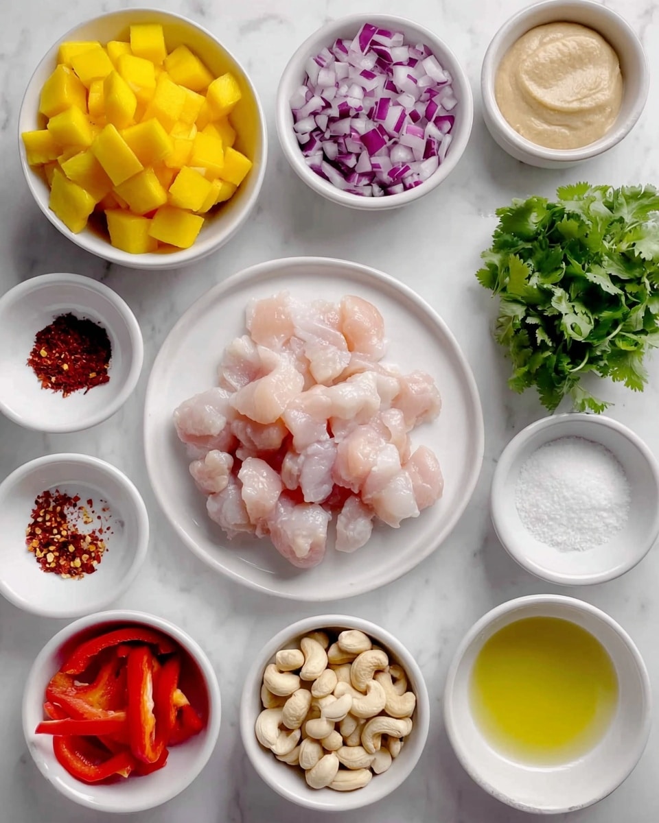 The image shows several small white bowls and one white plate arranged on a white marbled surface. The white plate in the center holds many pieces of raw pale pink meat with a shiny texture. A white bowl at the top left contains bright yellow mango pieces cut into cubes. To the right, a small white bowl is filled with a light beige, creamy paste. Below it, another small white bowl contains fresh green cilantro leaves. Adjacent to the cilantro, a small white bowl holds finely chopped purple and white onions. On the bottom right, a small white bowl is filled with whole light beige cashew nuts. At the bottom center, a small white bowl holds red chili flakes, and to its left, another small white bowl contains white coarse salt. On the far left, a small white bowl holds thin slices of bright red bell pepper. Above it, a small white bowl contains a pale yellow liquid. The overall setup has a clean look with fresh ingredients shown clearly. photo taken with an iphone --ar 4:5 --v 7