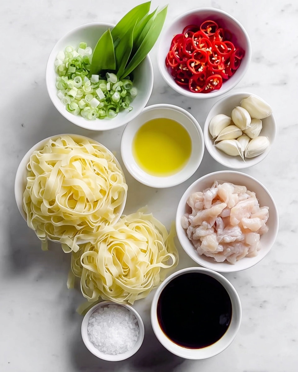 In a dark pan, wide flat noodles with a shiny brown sauce are mixed with bright green leafy vegetables and small pieces of cooked meat. Thin slices of red chili peppers are scattered on top, adding sharp pops of color. The noodles look tender and slightly twisted around the greens and meat. A wooden spatula is placed inside the pan with part of its handle visible, resting on the noodles. The pan sits on a white marbled surface with a few green leaves and red chili peppers around it. photo taken with an iphone --ar 4:5 --v 7