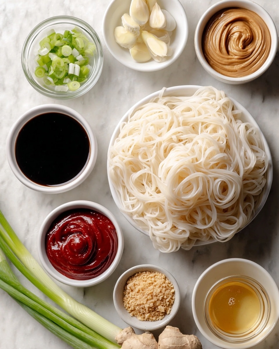 This image shows a close-up of a black pan filled with cooked thin noodles that have a shiny brown sauce coating them evenly. Small pieces of chopped green onions and crushed light-colored nuts are scattered throughout the noodles. A wooden utensil is lifting a portion of the noodles on the left side of the pan, wrapping some strands around it. The background is a white marbled texture. photo taken with an iphone --ar 4:5 --v 7