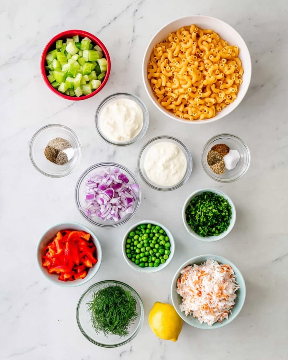 The image shows 10 bowls and one lemon arranged on a white marbled surface. At the top right, a white bowl is filled with uncooked elbow macaroni, golden yellow in color and smooth in texture. To its left, a small white bowl contains green celery pieces, chopped into small chunks. Below that, a white bowl holds a creamy white sauce with a smooth, thick texture. Next to the sauce, another white bowl contains finely chopped purple-red onions. Below these, a small clear bowl has four spices: red, white, black, and green powders separated inside. Beside the spices, a small white bowl is filled with green peas, round and vibrant. Nearby, another small white bowl holds green chopped chives, finely cut. A clear bowl below contains fresh green dill, finely chopped with a feathery look. On the lower left, a single lemon with smooth yellow skin rests beside a small white bowl filled with finely chopped red bell peppers. Lastly, a larger white bowl at the bottom right contains white and red chunks of imitation crab meat, roughly chopped. All items are on a clean white marbled surface. Photo taken with an iphone --ar 4:5 --v 7